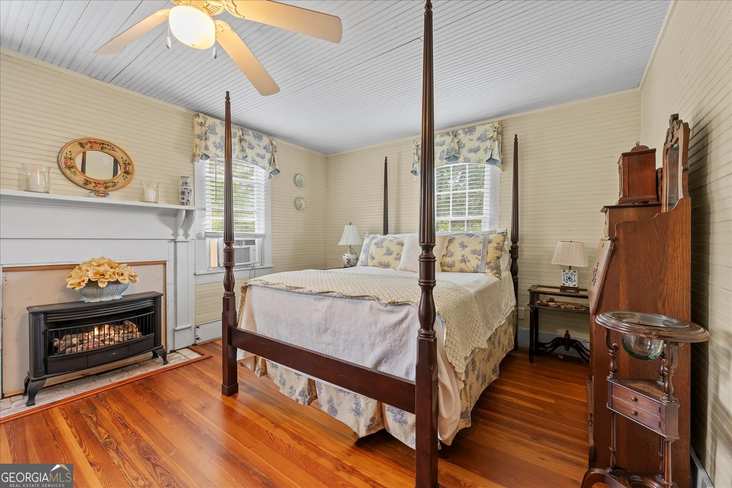 6644 East Cadley Road Norwood, GA 30821 - Photo 37 of 53 a bedroom with a bed and a fireplace