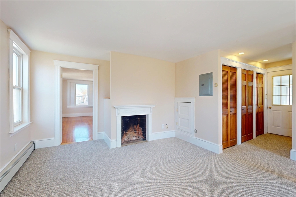 18 Faneuil Road, Unit 18 Waltham, MA 02452 - Photo 12 of 20 a view of empty room with a fireplace