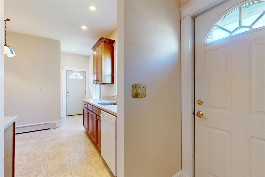 18 Faneuil Road, Unit 18 Waltham, MA 02452 - Photo 4 of 20 a bathroom with a sink and mirror
