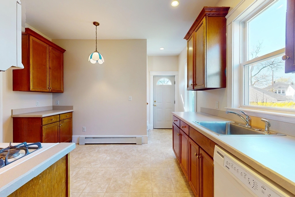 18 Faneuil Road, Unit 18 Waltham, MA 02452 - Photo 5 of 20 a kitchen that has a sink and a stove
