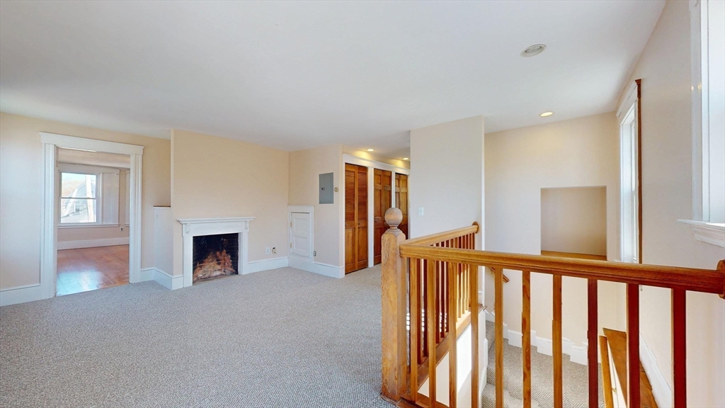 18 Faneuil Road, Unit 18 Waltham, MA 02452 - Photo 9 of 20 a view of a livingroom with a fireplace