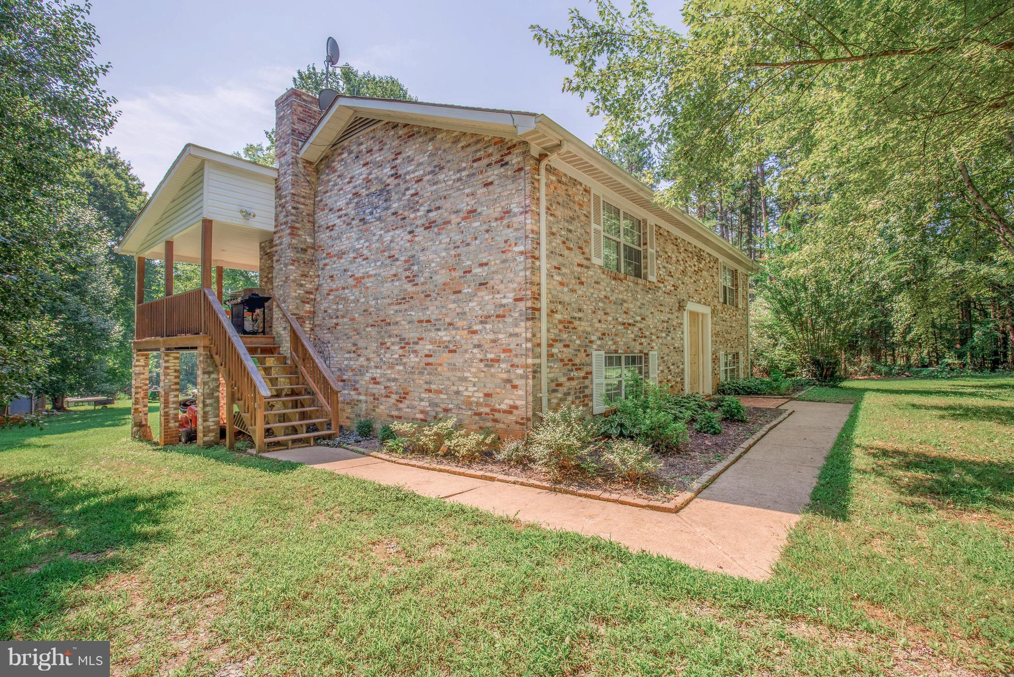 2262 Hanback Road Gordonsville, VA 22942 - Photo 2 of 24 a view of a large house with a yard