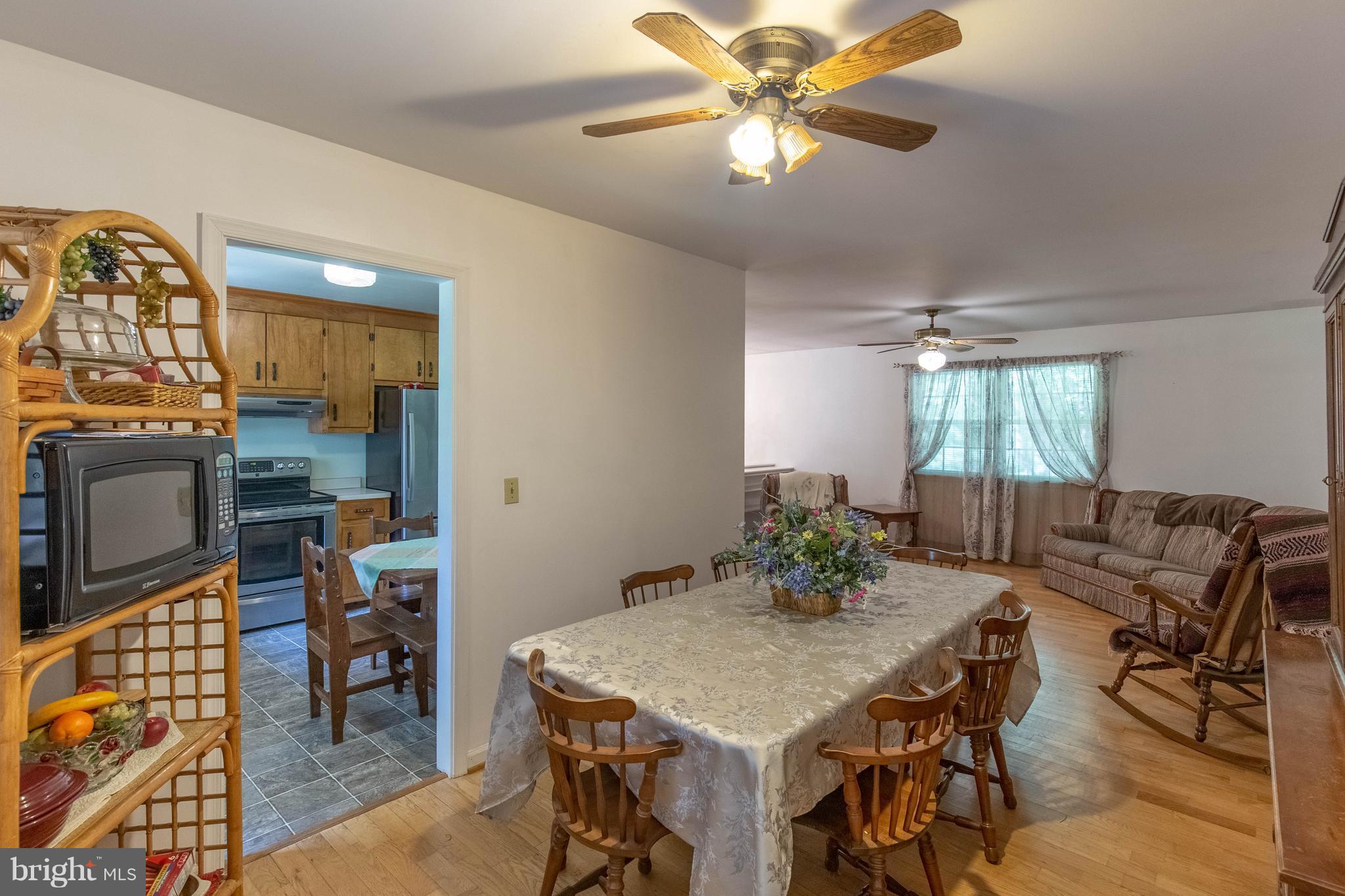 2262 Hanback Road Gordonsville, VA 22942 - Photo 11 of 24 a view of a dining room with furniture window and wooden floor
