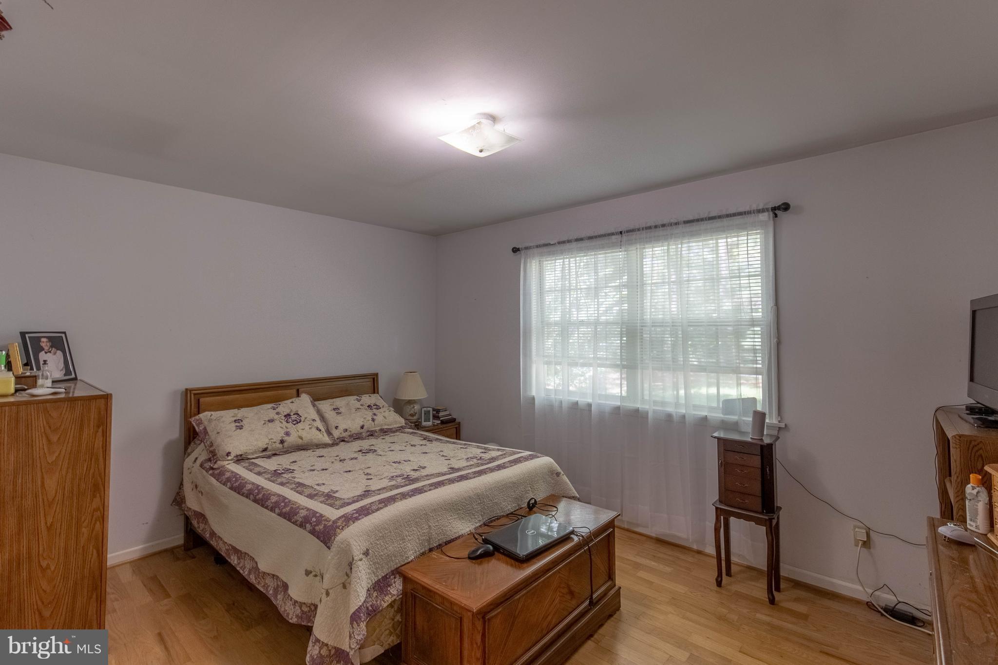 2262 Hanback Road Gordonsville, VA 22942 - Photo 16 of 24 a bedroom with a bed and wooden floor