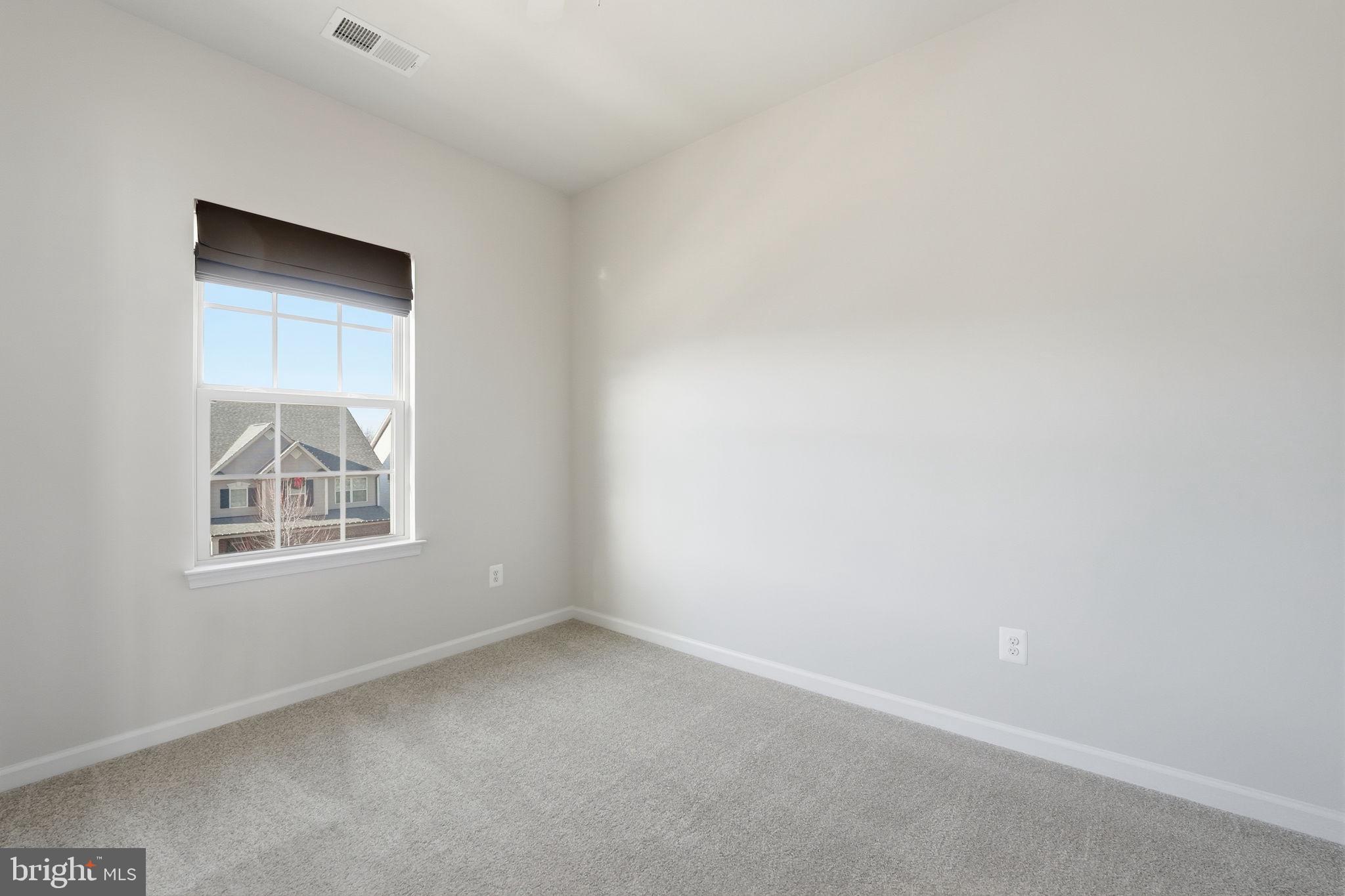 18179 Red Mulberry Road Dumfries, VA 22026 - Photo 20 of 58 an empty room with a window