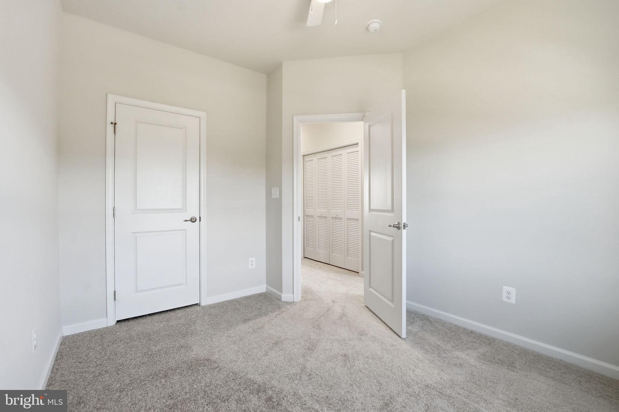 18179 Red Mulberry Road Dumfries, VA 22026 - Photo 21 of 58 an empty room with closet area