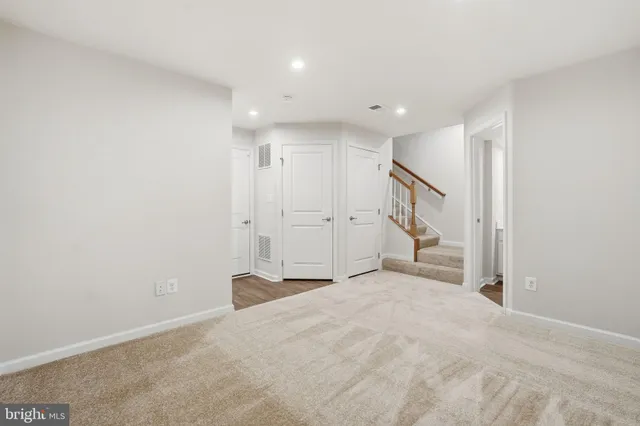 an empty room with closet area