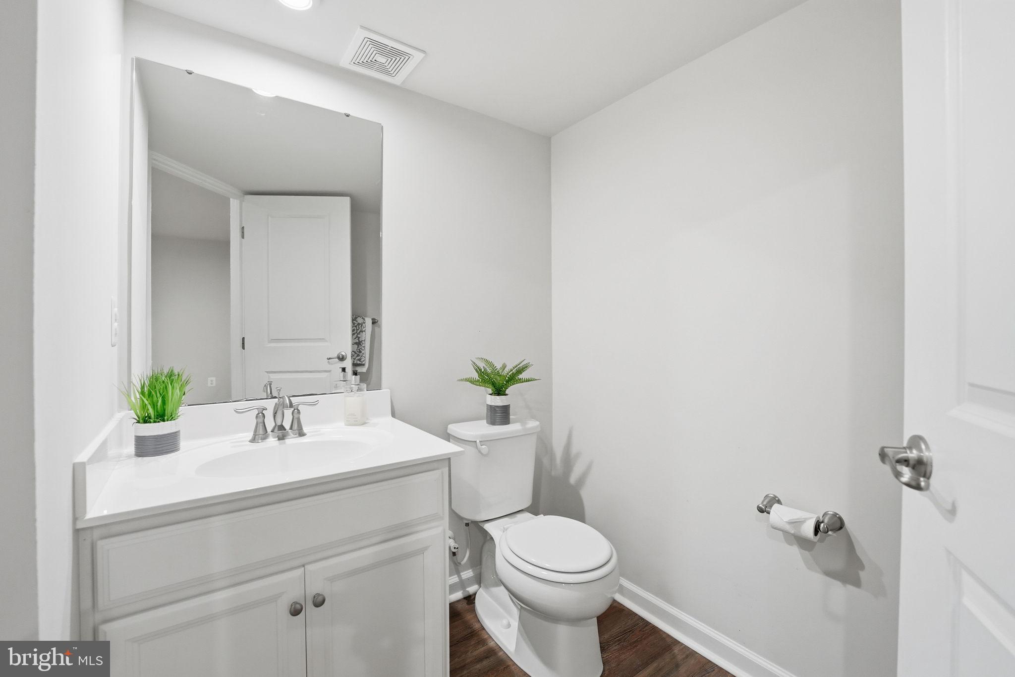 18179 Red Mulberry Road Dumfries, VA 22026 - Photo 23 of 58 a bathroom with a sink toilet and a mirror