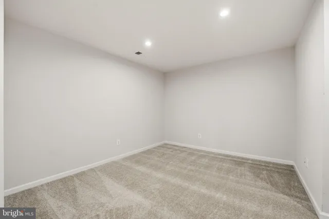 a bathroom with a sink toilet and a mirror