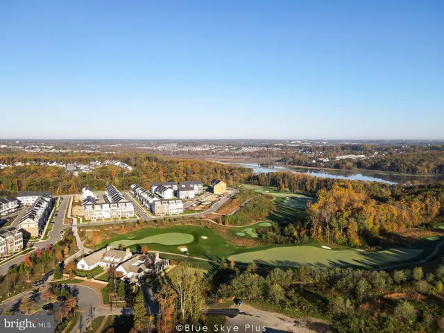 a living room with furniture a fireplace and a dining table