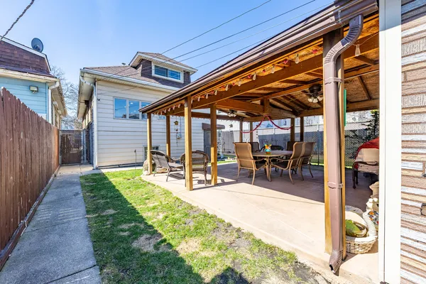 a view of a backyard with a patio