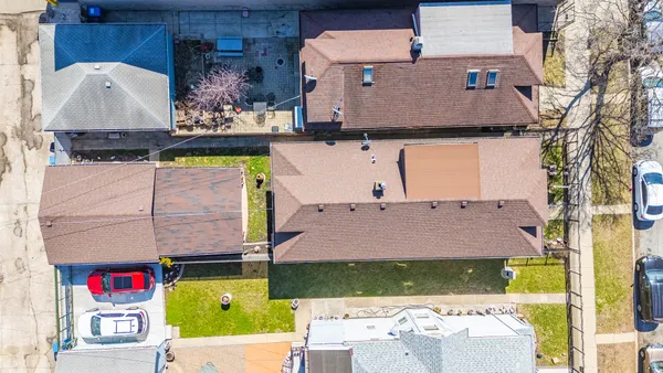 an aerial view of house with yard