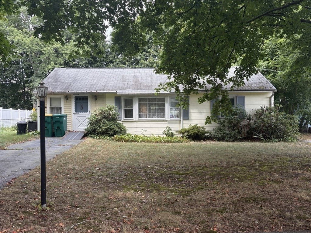 8 Boyd Road Woburn, MA 01801 - Photo 3 of 11 a house that has a tree in front of it