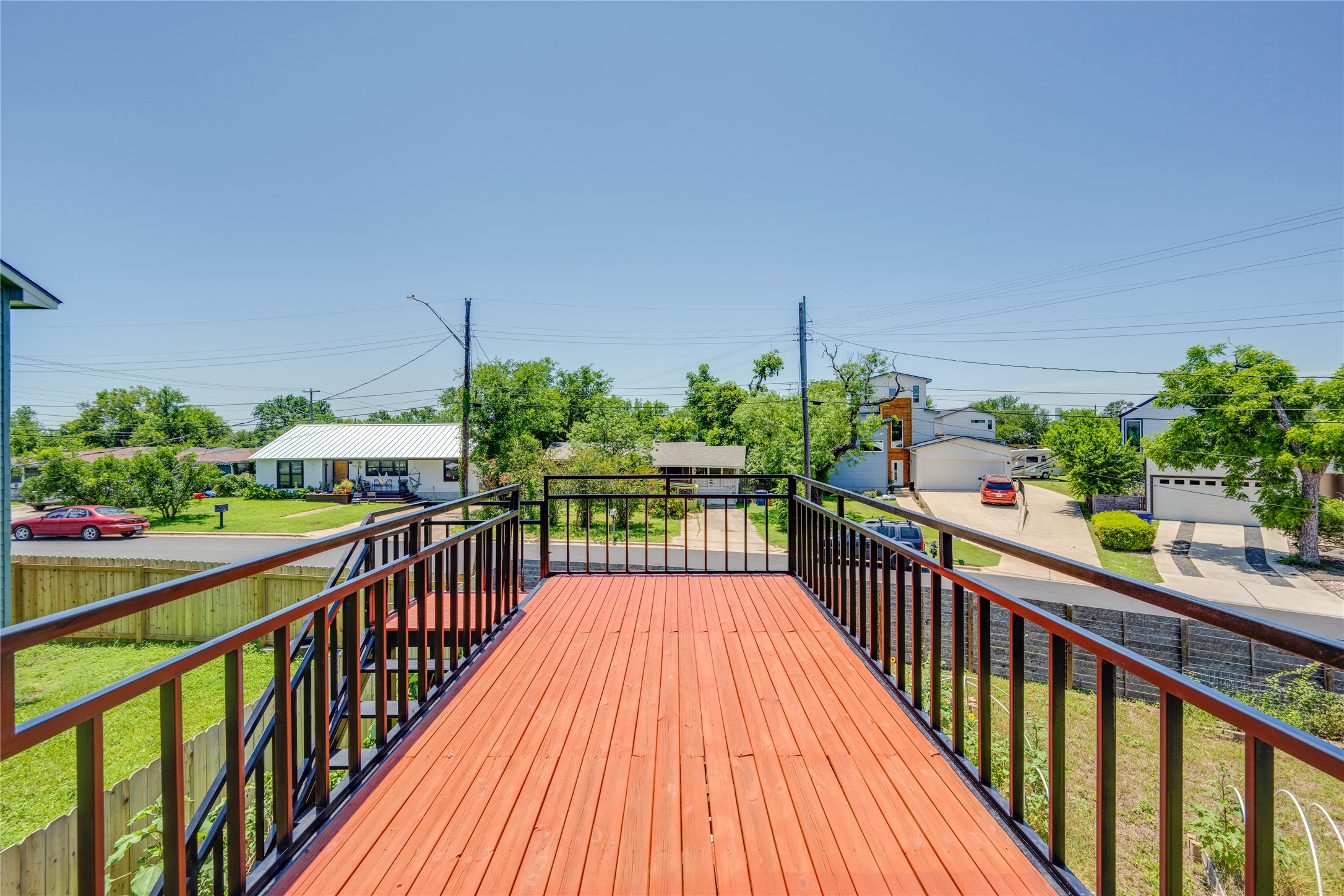 1707 Overhill Drive Austin, TX 78721 - Photo 25 of 36 An inviting wood-plank deck offers elevated neighborhood views and ample space for relaxation.