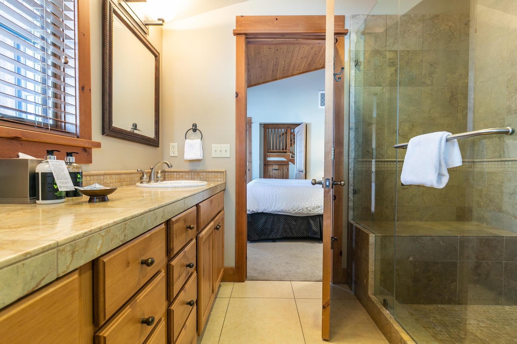 12368 Frontier Trail, Unit F2911 Truckee, CA 96161 - Photo 22 of 28 a en suite bathroom with a sink and a mirror