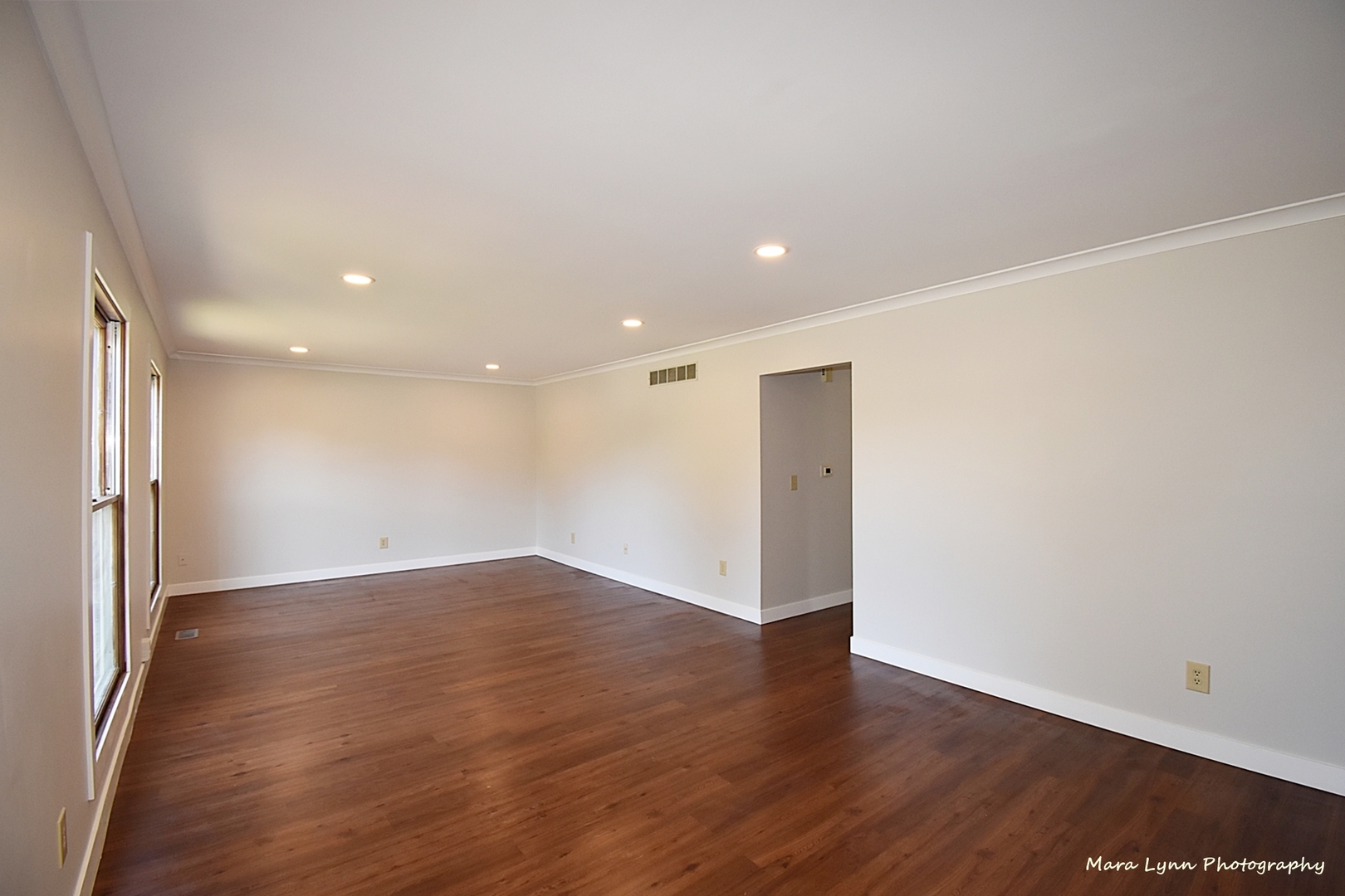 1470 South Tyler Road St. Charles, IL 60174 - Photo 4 of 37 an empty room with wooden floor and windows