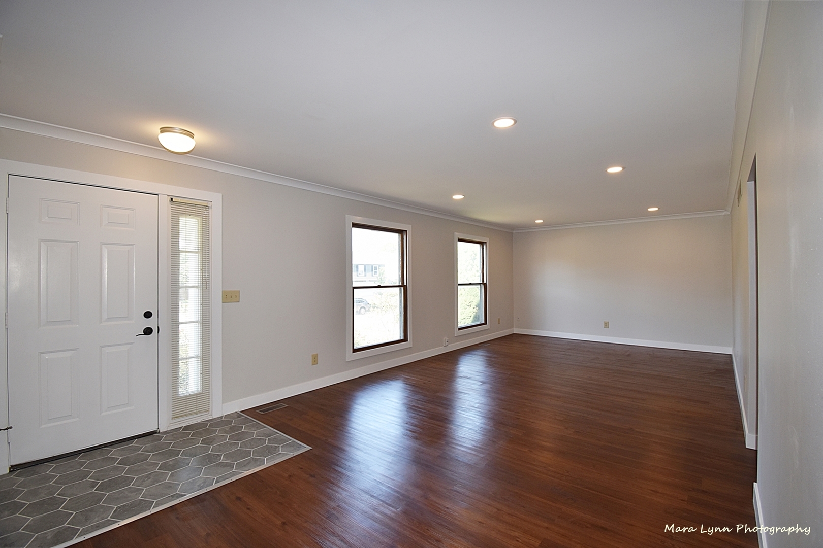 1470 South Tyler Road St. Charles, IL 60174 - Photo 5 of 37 a view of an empty room with wooden floor and windows
