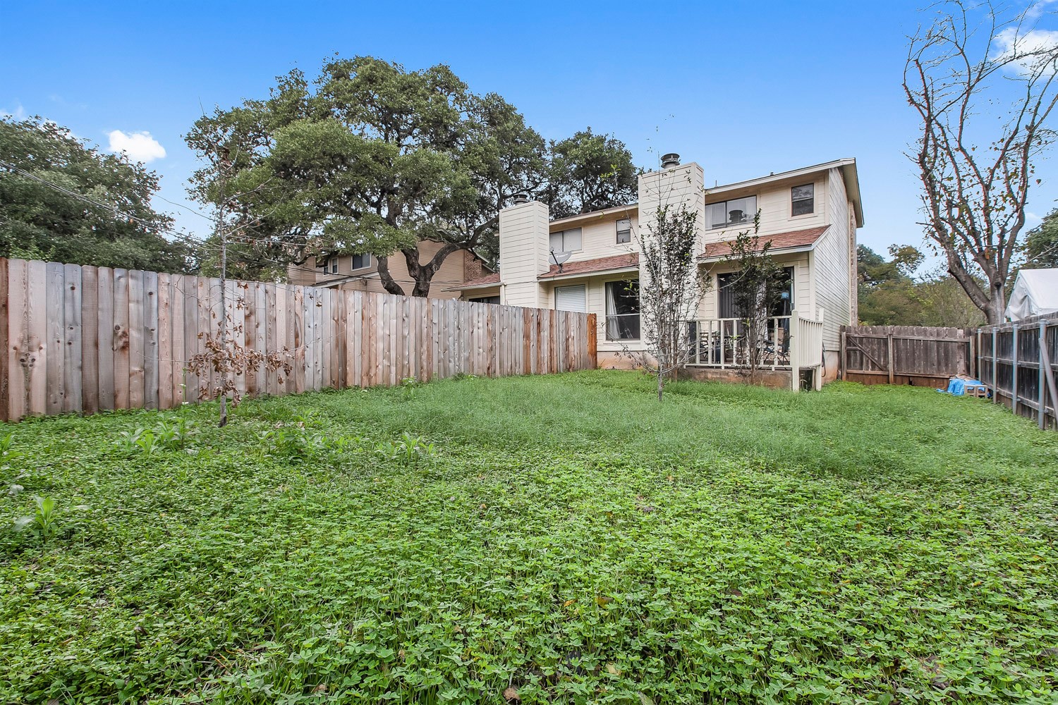 6029 Old Fredericksburg Road, Unit A Austin, TX 78749 - Photo 20 of 20 a view of a house with a yard and sitting area
