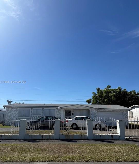 a view of car parked in middle of the yard