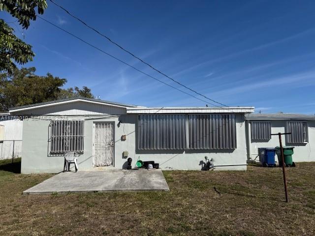 10460 Southwest 149th Street Miami, FL 33176 - Photo 2 of 3 a front view of a house with garden
