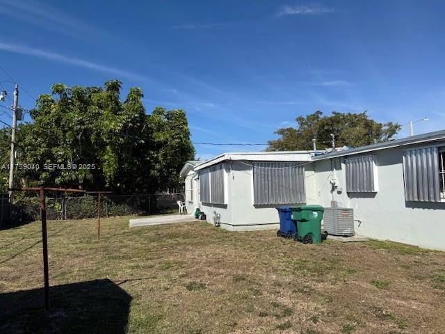 10460 Southwest 149th Street Miami, FL 33176 - Photo 3 of 3 a front view of a house with a yard