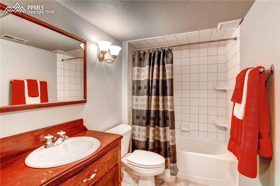 12330 Motley Road Peyton, CO 80831 - Photo 23 of 27 The basement also has a full bath with tiled shower/tub