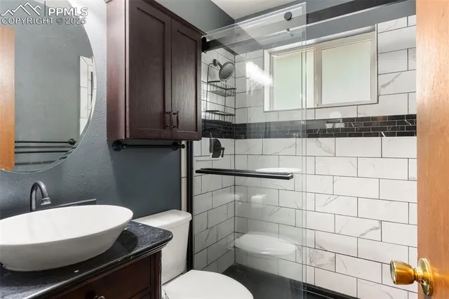 a view of livingroom with furniture window and front door
