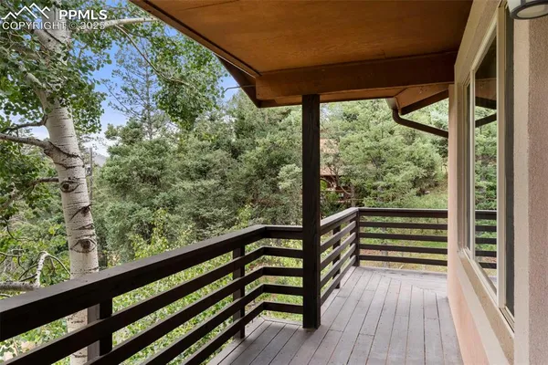 a view of balcony with wooden floor