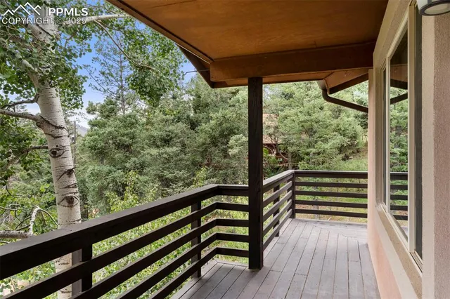 a view of balcony with wooden floor