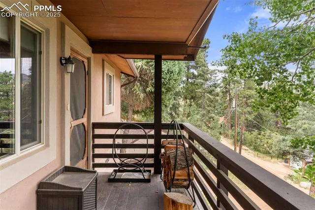 a view of balcony with furniture