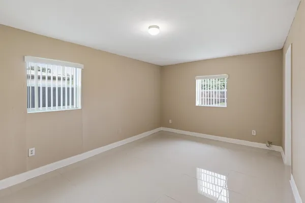 a view of an empty room and closet area
