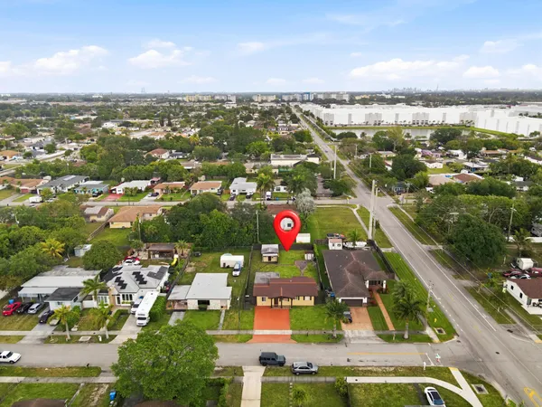 an aerial view of residential houses with outdoor space