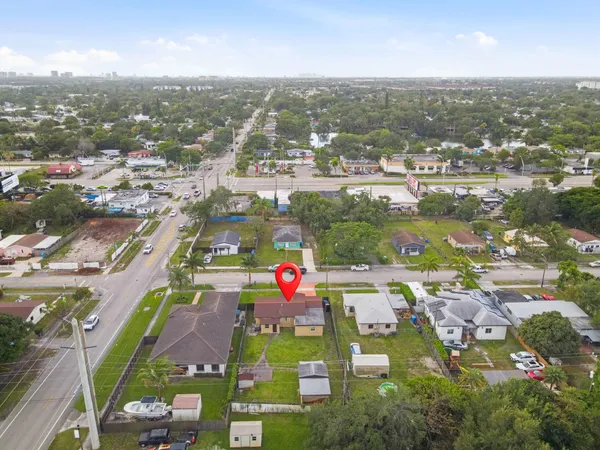 an aerial view of residential houses with outdoor space