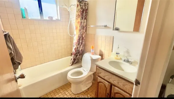 a bedroom with a bed and cabinets