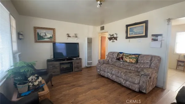 a kitchen with a stove a sink and a refrigerator