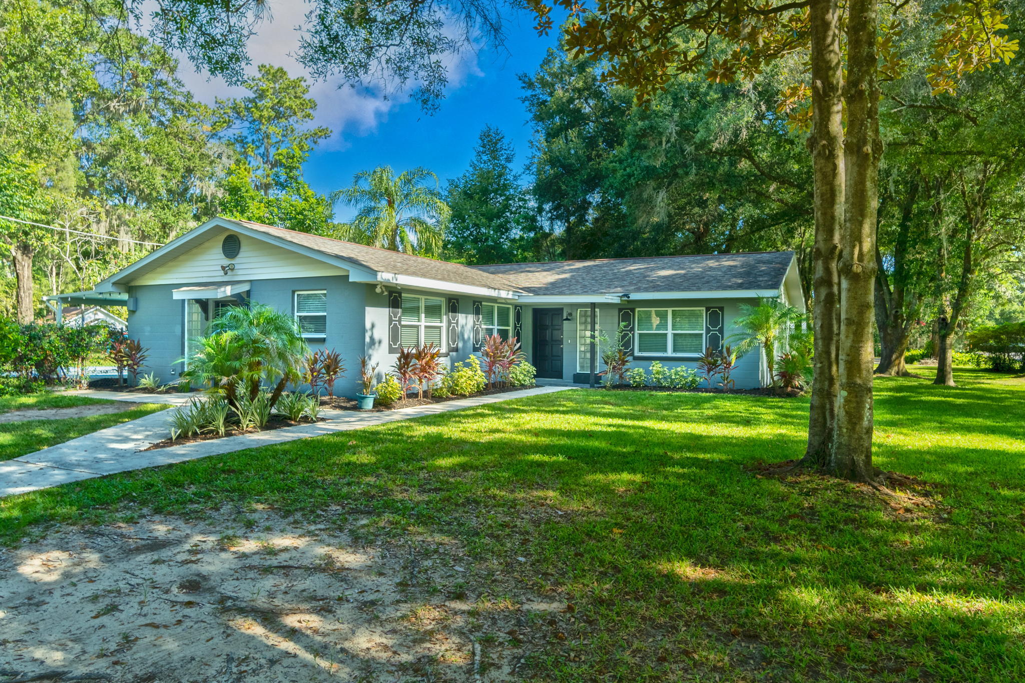 3411 Ranch Road Valrico, FL 33596 - Photo 3 of 28 a front view of a house with a yard