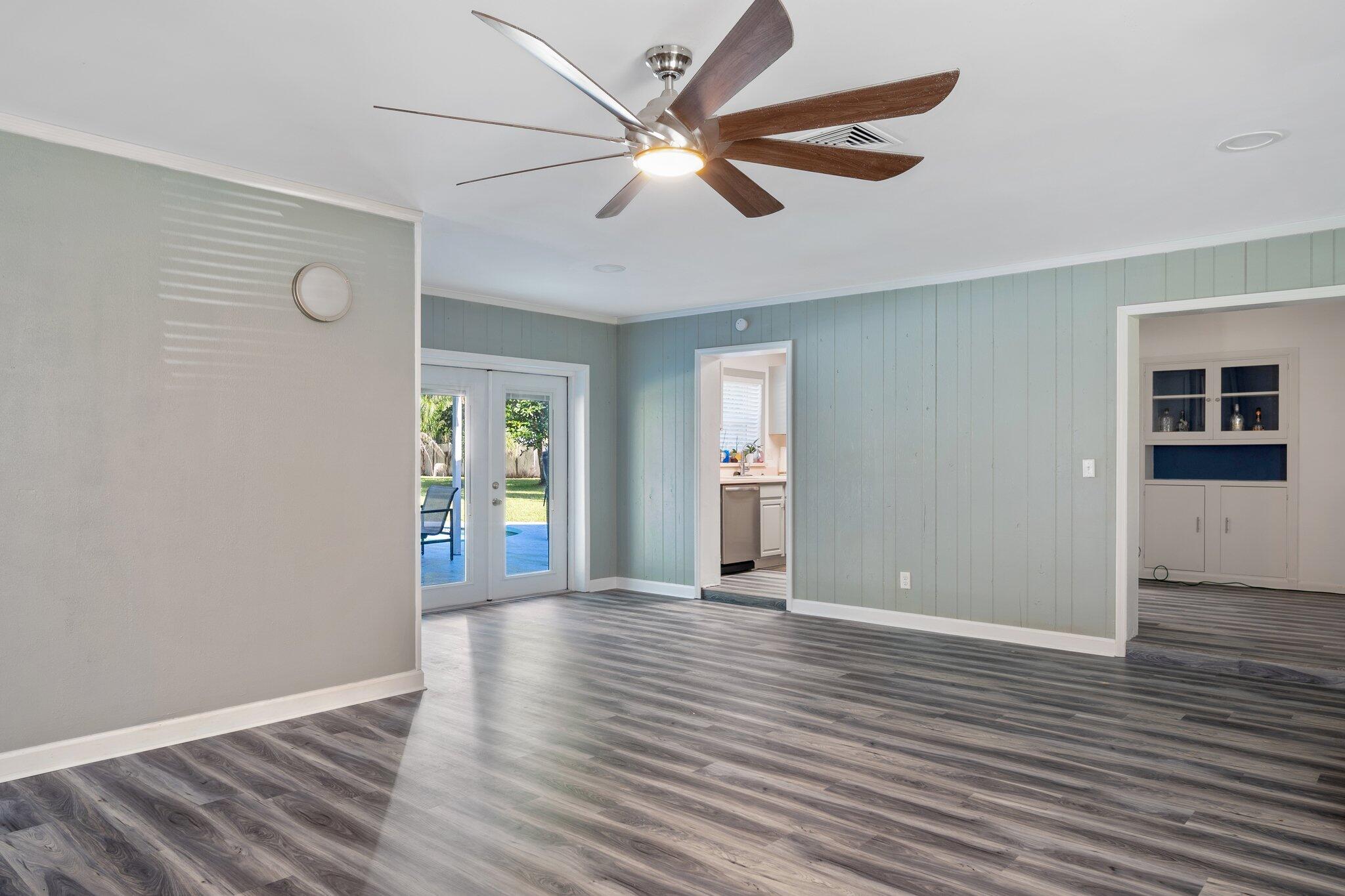 3411 Ranch Road Valrico, FL 33596 - Photo 8 of 28 an empty room with wooden floor and windows