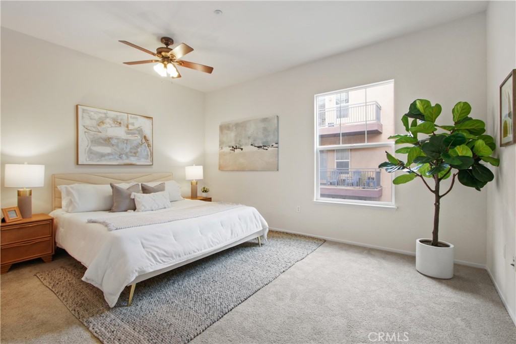 136 Soco Drive Fullerton, CA 92832 - Photo 18 of 35 a bedroom with a bed lamp and a potted plant