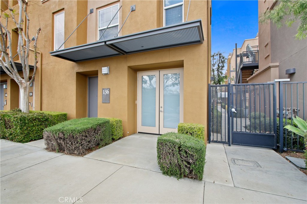 136 Soco Drive Fullerton, CA 92832 - Photo 2 of 35 a view of a pathway along the building