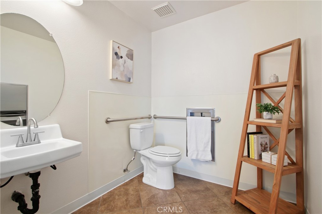 136 Soco Drive Fullerton, CA 92832 - Photo 7 of 35 a white toilet sitting next to a bathroom sink