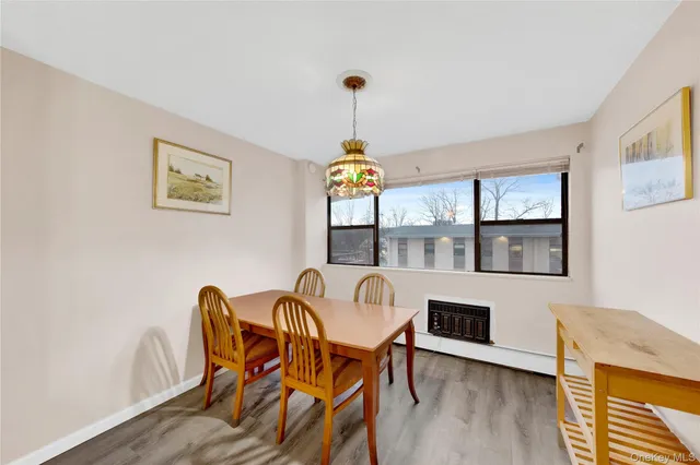 a bedroom with a bed a table and chair