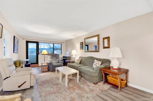 a living room with furniture or couch and a window