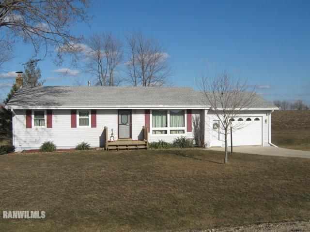 1275 South Bolton Road Freeport, IL 61032 - Photo 1 of 12 a front view of a house with a yard