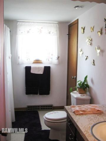 1275 South Bolton Road Freeport, IL 61032 - Photo 10 of 12 a bathroom with a granite countertop sink and a toilet