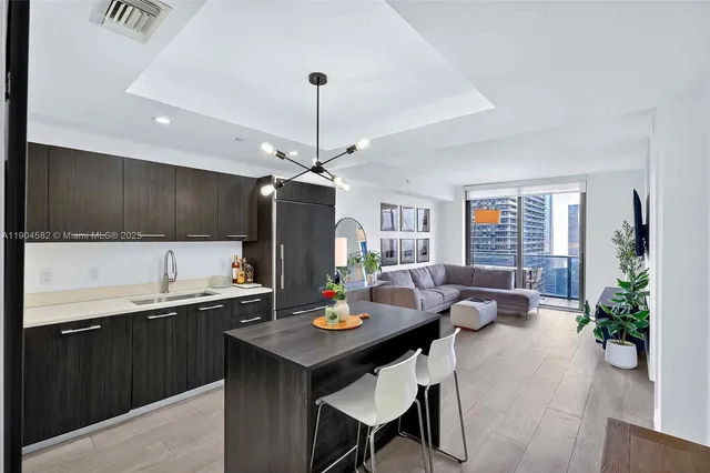 a kitchen with a table and chairs in it