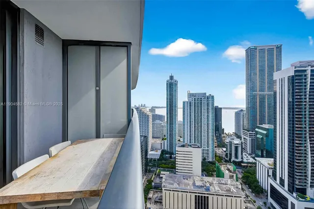 a bathroom with a shower and a sink