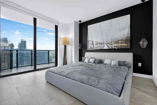 a bathroom with a sink mirror and a tub
