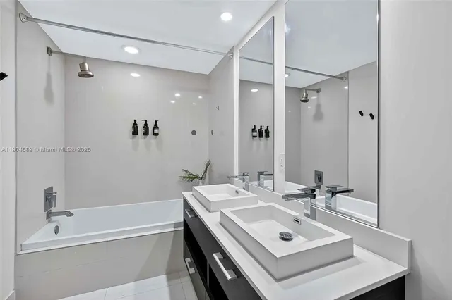 a view of a hallway with wooden floor and furniture