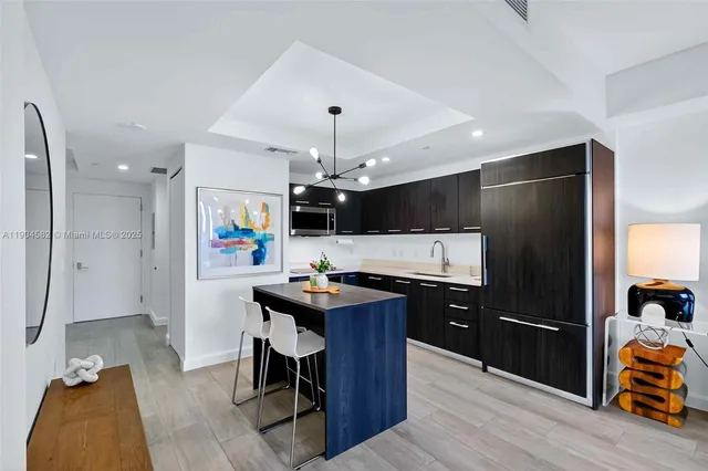 a kitchen with a sink stove and microwave