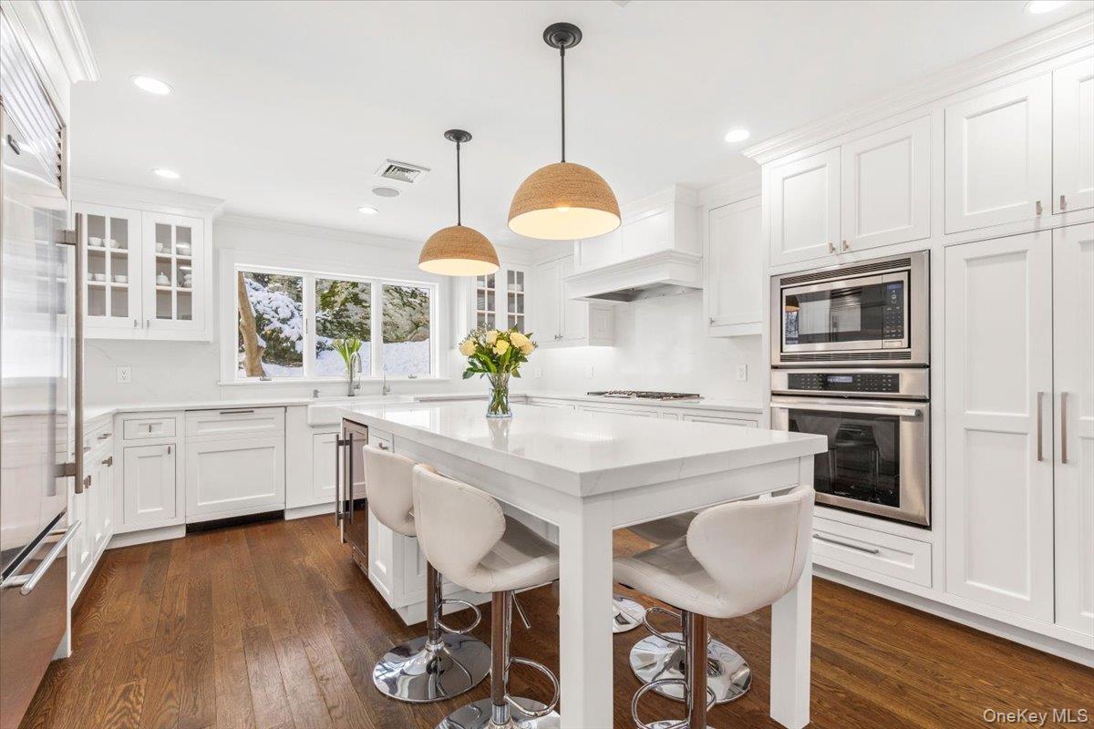 14 Eagles Bluff Rye Brook, NY 10573 - Photo 12 of 48 Renovated in 2022 the kitchen has white quartz countertops, stainless steel top of the line appliances, pantry and amazing island with seating for five
